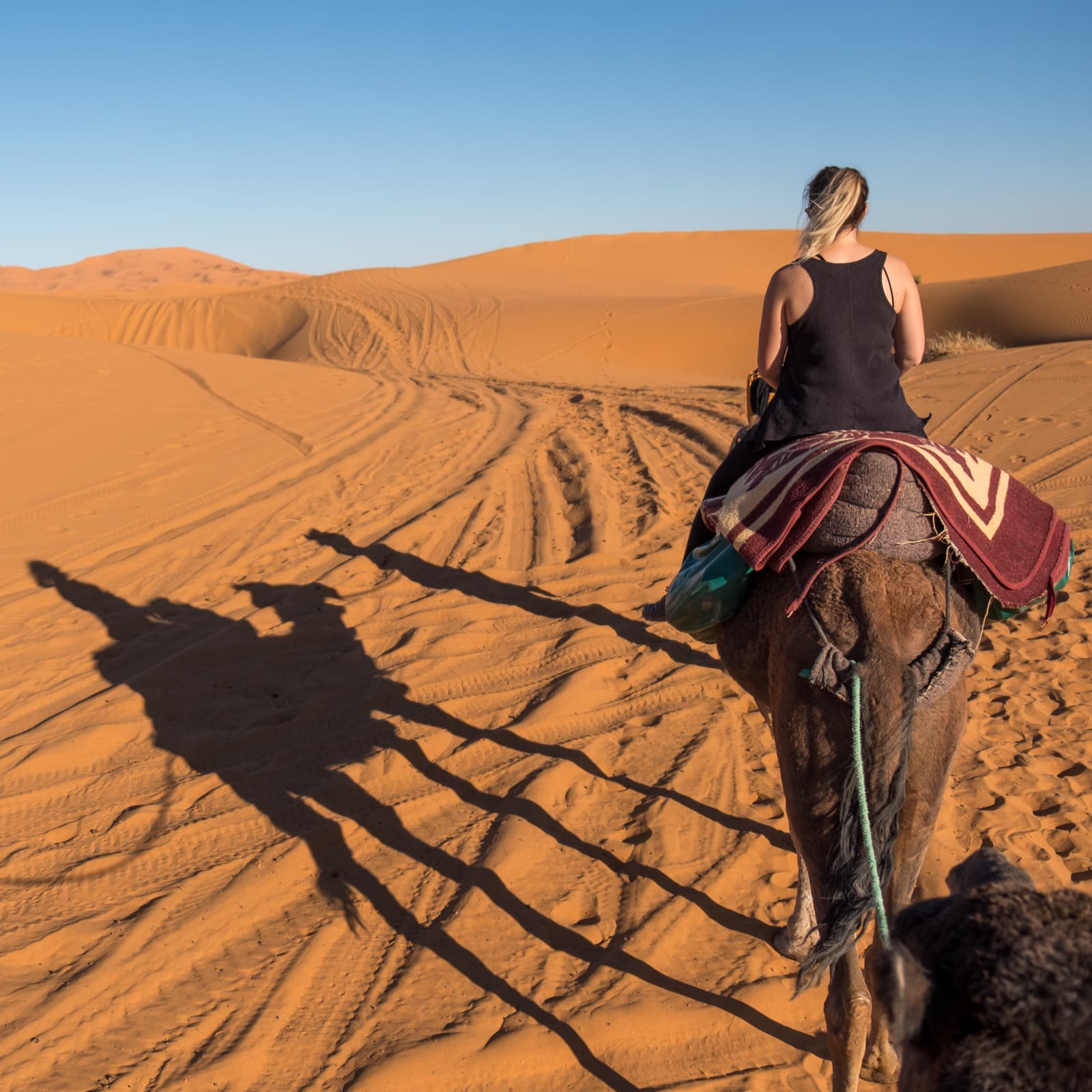 caroline-riding-a-camel-from-merzouga
